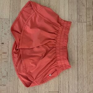 Women’s orange Lululemon shorts